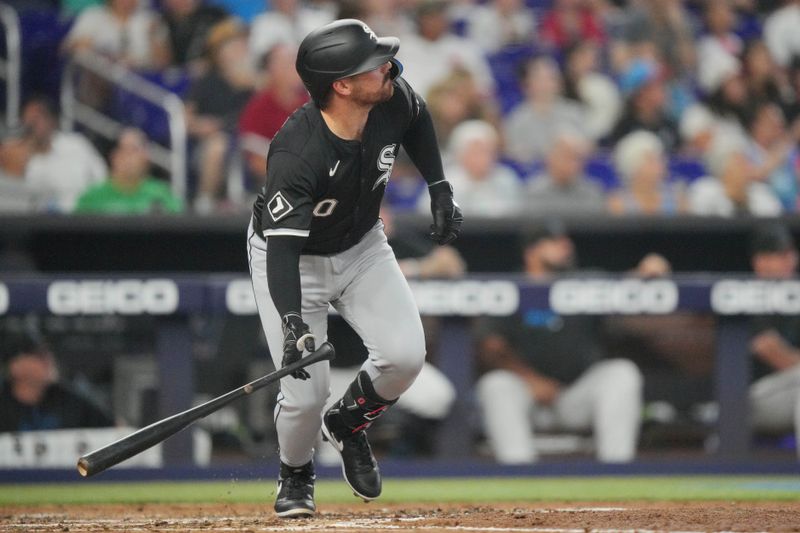 Jul 7, 2024; Miami, Florida, USA;  Chicago White Sox third baseman Danny Mendick (0) hits a two-run home run in the fourth inning against the Miami Marlins at loanDepot Park. Mandatory Credit: Jim Rassol-USA TODAY Sports