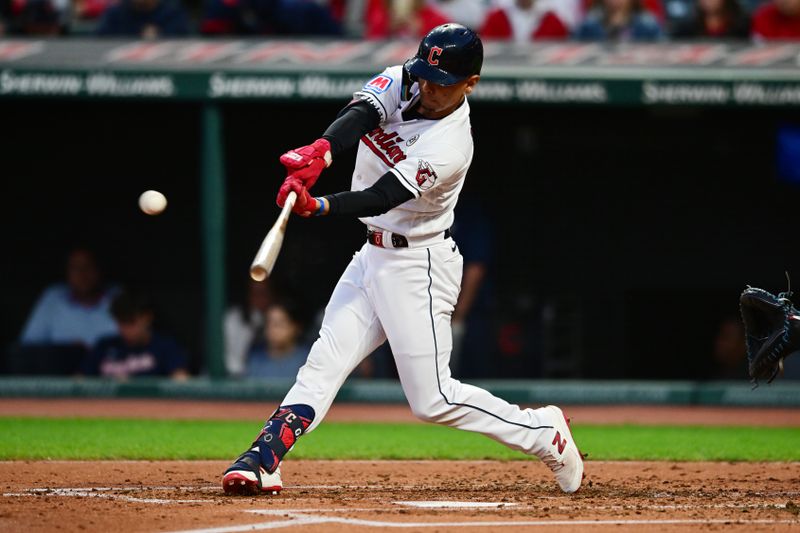 Sep 15, 2023; Cleveland, Ohio, USA; Cleveland Guardians second baseman Andres Gimenez (0) hits a home run during the second inning against the Texas Rangers at Progressive Field. Mandatory Credit: Ken Blaze-USA TODAY Sports