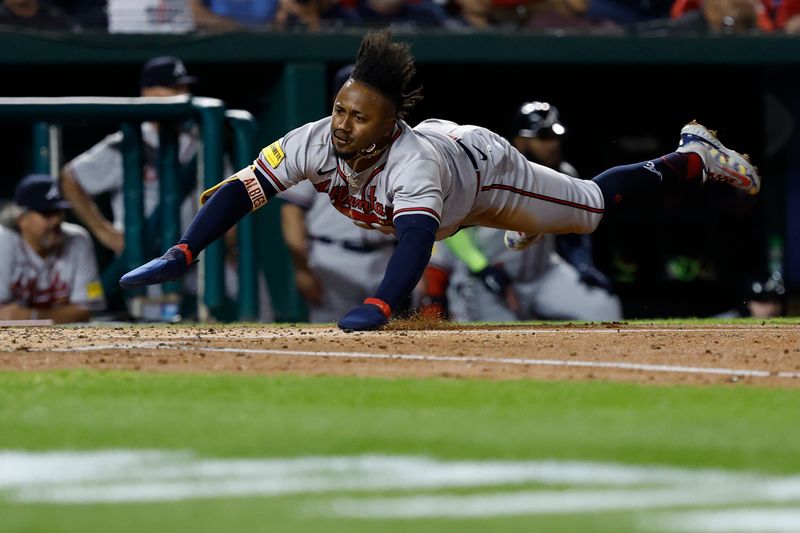 Sep 21, 2023; Washington, District of Columbia, USA; Atlanta Braves second baseman Ozzie Albies (1) scores a run on a single by Atlanta Braves third baseman Austin Riley (not pictured) against the Washington Nationals during the third inning at Nationals Park. Mandatory Credit: Geoff Burke-USA TODAY Sports