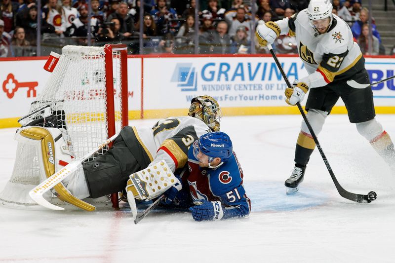 Nov 27, 2024; Denver, Colorado, USA; Colorado Avalanche right wing Nikolai Kovalenko (51) collides with Vegas Golden Knights goaltender Adin Hill (33) in the second period at Ball Arena. Mandatory Credit: Isaiah J. Downing-Imagn Images