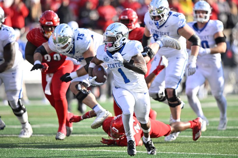 Nov 25, 2023; Louisville, Kentucky, USA;  Kentucky Wildcats running back Ray Davis (1) runs the ball against the Louisville Cardinals during the second half at L&N Federal Credit Union Stadium. Kentucky defeated Louisville 38-31. Mandatory Credit: Jamie Rhodes-USA TODAY Sports