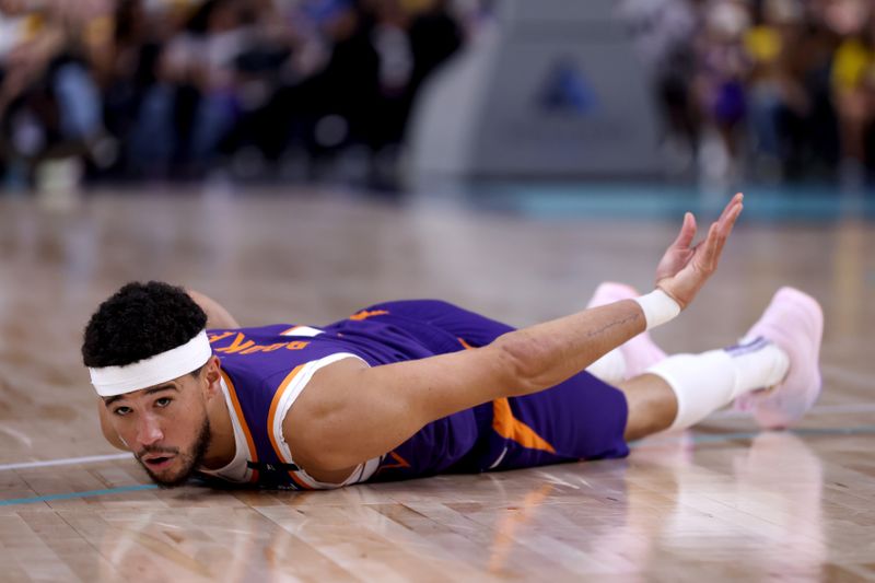 PALM SPRINGS, CALIFORNIA - OCTOBER 06: Devin Booker #1 of the Phoenix Suns reacts after a basket during the first quarter against the Los Angeles Lakers at Acrisure Arena on October 06, 2024 in Palm Springs, California. NOTE TO USER: User expressly acknowledges and agrees that, by downloading and/or using this photograph, user is consenting to the terms and conditions of the Getty Images License Agreement. (Photo by Katelyn Mulcahy/Getty Images)