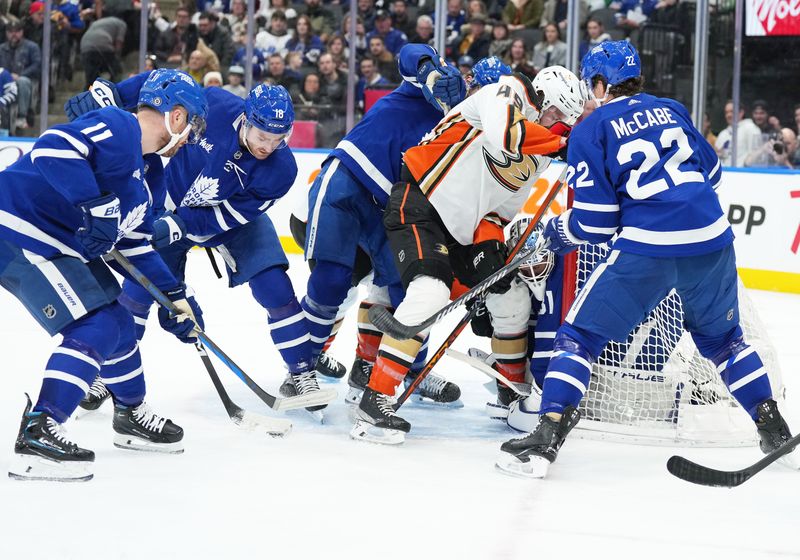 Feb 17, 2024; Toronto, Ontario, CAN; Anaheim Ducks left wing Max Jones (49) battles for the puck in front of Toronto Maple Leafs goaltender Martin Jones (31) during the second period at Scotiabank Arena. Mandatory Credit: Nick Turchiaro-USA TODAY Sports