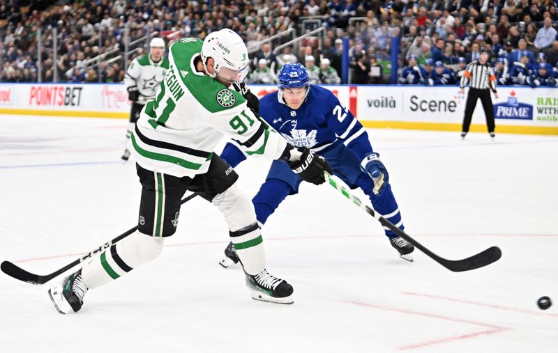 Feb 7, 2024; Toronto, Ontario, CAN; Dallas Stars forward Tyler Seguin (91) shoots the puck past Toronto Maple Leafs forward Pontus Holmberg (29) in the first period at Scotiabank Arena. Mandatory Credit: Dan Hamilton-USA TODAY Sports