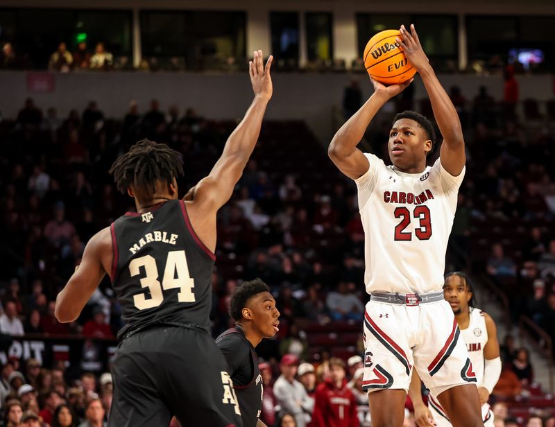 Jan 14, 2023; Columbia, South Carolina, USA; South Carolina Gamecocks forward Gregory Jackson II (23) shoots over Texas A&M Aggies forward Julius Marble (34) in the first half at Colonial Life Arena. Mandatory Credit: Jeff Blake-USA TODAY Sports