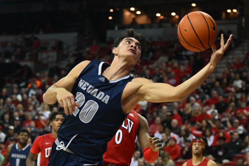 Jan 28, 2023; Las Vegas, Nevada, USA; Nevada Wolf Pack guard Daniel Foster (20) pulls in a rebound against the UNLV Runnin' Rebels in the first half at Thomas & Mack Center. Mandatory Credit: Candice Ward-USA TODAY Sports