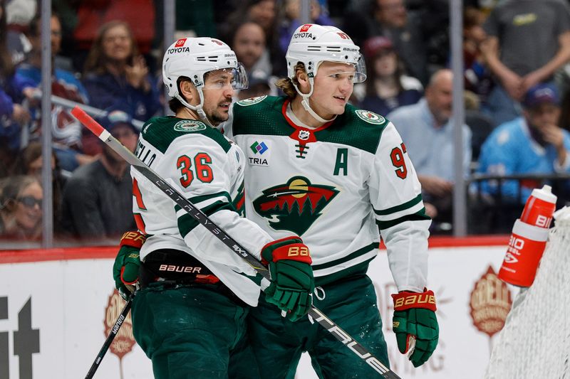 Apr 9, 2024; Denver, Colorado, USA; Minnesota Wild left wing Kirill Kaprizov (97) celebrates his goal with right wing Mats Zuccarello (36) in the first period against the Colorado Avalanche at Ball Arena. Mandatory Credit: Isaiah J. Downing-USA TODAY Sports