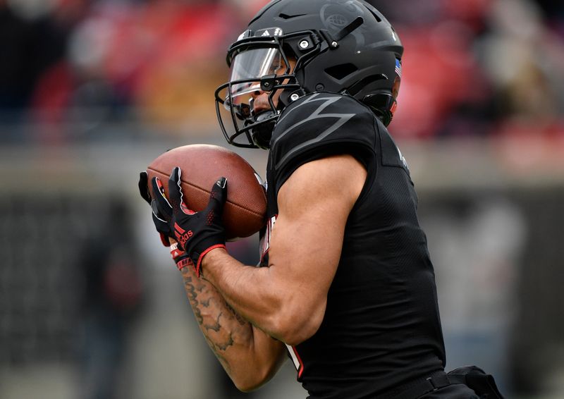 Nov 13, 2021; Louisville, Kentucky, USA;  Louisville Cardinals wide receiver Jordan Watkins (1) pulls in a pass during the second quarter against the Syracuse Orange at Cardinal Stadium. Louisville defeated Syracuse 41-3. Mandatory Credit: Jamie Rhodes-USA TODAY Sports