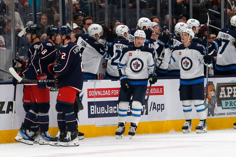 Nov 1, 2024; Columbus, Ohio, USA; Winnipeg Jets left wing Nikolaj Ehlers (27) celebrates his hat trick goal against the Columbus Blue Jackets during the second period at Nationwide Arena. Mandatory Credit: Russell LaBounty-Imagn Images