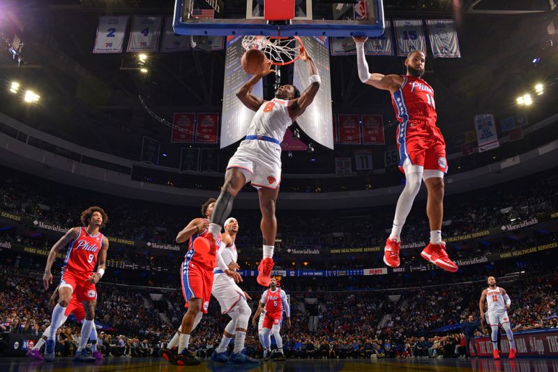 PHILADELPHIA, PA - NOVEMBER 12: OG Anunoby #8 of the New York Knicks dunks the ball during the game against the Philadelphia 76ers during the Emirates NBA Cup game on November 12, 2024 at the Wells Fargo Center in Philadelphia, Pennsylvania NOTE TO USER: User expressly acknowledges and agrees that, by downloading and/or using this Photograph, user is consenting to the terms and conditions of the Getty Images License Agreement. Mandatory Copyright Notice: Copyright 2024 NBAE (Photo by Jesse D. Garrabrant/NBAE via Getty Images)