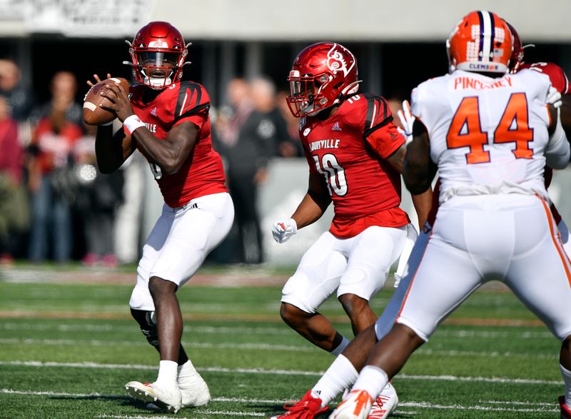 Oct 19, 2019; Louisville, KY, USA; Louisville Cardinals quarterback Micale Cunningham (3) looks to pass against the Clemson Tigers during the first quarter of play at Cardinal Stadium. Mandatory Credit: Jamie Rhodes-USA TODAY Sports