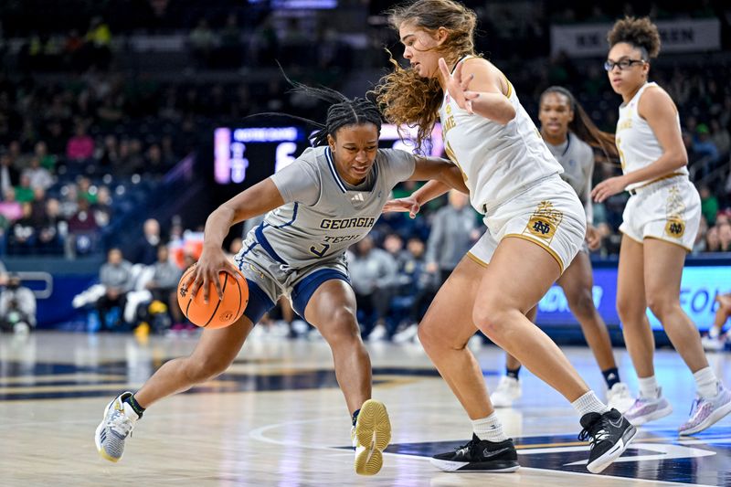 Feb 23, 2023; South Bend, Indiana, USA; Georgia Tech Yellow Jackets guard Tonie Morgan (5) dribbles as Notre Dame Fighting Irish forward Maddy Westbeld (21) defends in the first half at the Purcell Pavilion. Mandatory Credit: Matt Cashore-USA TODAY Sports