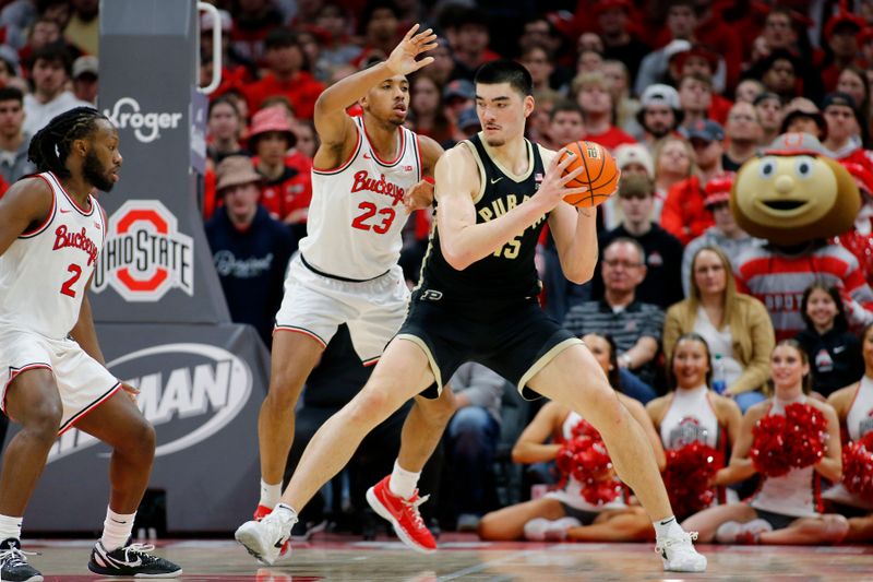 Feb 18, 2024; Columbus, Ohio, USA;  Purdue Boilermakers center Zach Edey (15) looks fore the ball as Ohio State Buckeyes forward Zed Key (23) defends during the second half at Value City Arena. Mandatory Credit: Joseph Maiorana-USA TODAY Sports