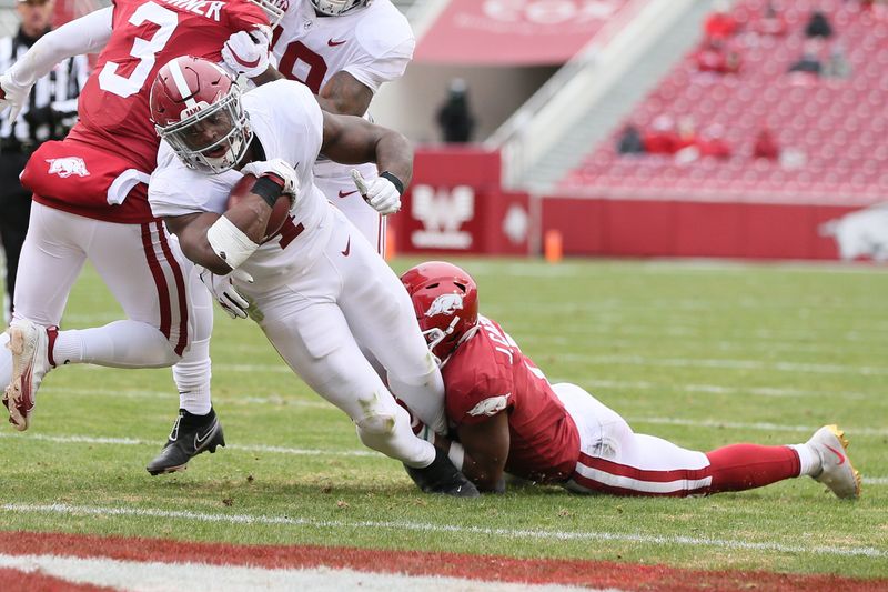 Dec 12, 2020; Fayetteville, Arkansas, USA;  Alabama Crimson Tide running back Brian Robinson Jr. (4) scores a touchdown in the second quarter against the Arkansas Razorbacks at Donald W. Reynolds Razorback Stadium. Mandatory Credit: Nelson Chenault-USA TODAY Sports