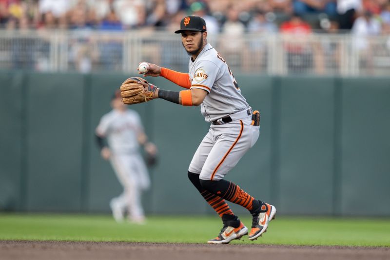 May 23, 2023; Minneapolis, Minnesota, USA; San Francisco Giants shortstop Thairo Estrada (39) looks to throw to first base for an out in the fourth inning against the Minnesota Twins at Target Field. Mandatory Credit: Jesse Johnson-USA TODAY Sports