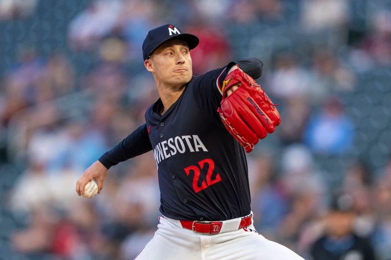 Jun 10, 2024; Minneapolis, Minnesota, USA; Minnesota Twins pitcher Griffin Jax (22) delivers a pitch against the Colorado Rockies in the eighth inning at Target Field. Mandatory Credit: Jesse Johnson-USA TODAY Sports