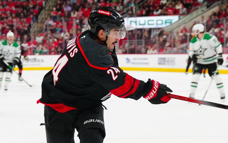 Nov 25, 2024; Raleigh, North Carolina, USA;  Carolina Hurricanes center Seth Jarvis (24) takes. A shot against the Dallas Stars during the first period at Lenovo Center. Mandatory Credit: James Guillory-Imagn Images