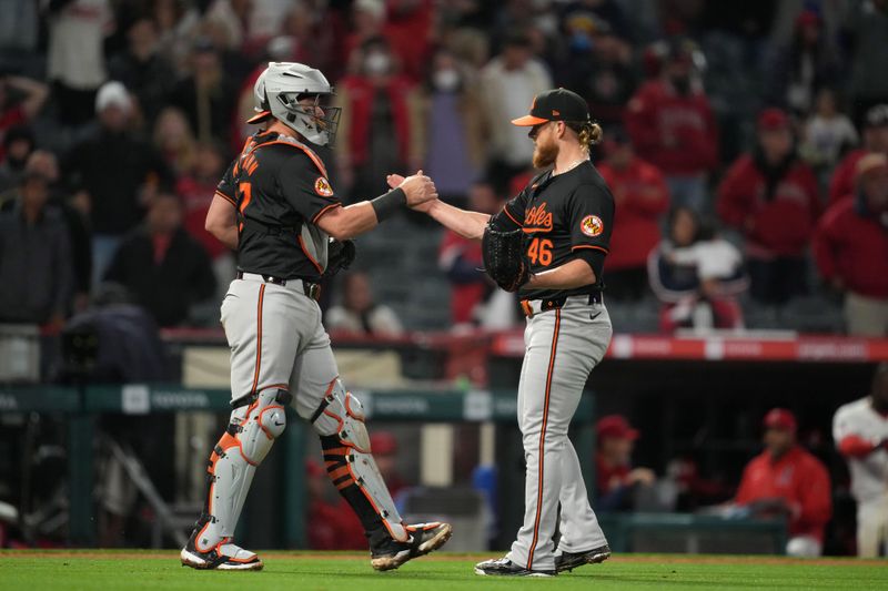 Apr 22, 2024; Anaheim, California, USA; Baltimore Orioles catcher James McCann (27) and pitcher Craig Kimbrel (46) celebrate after the game against the Los Angeles Angels at Angel Stadium. Mandatory Credit: Kirby Lee-USA TODAY Sports