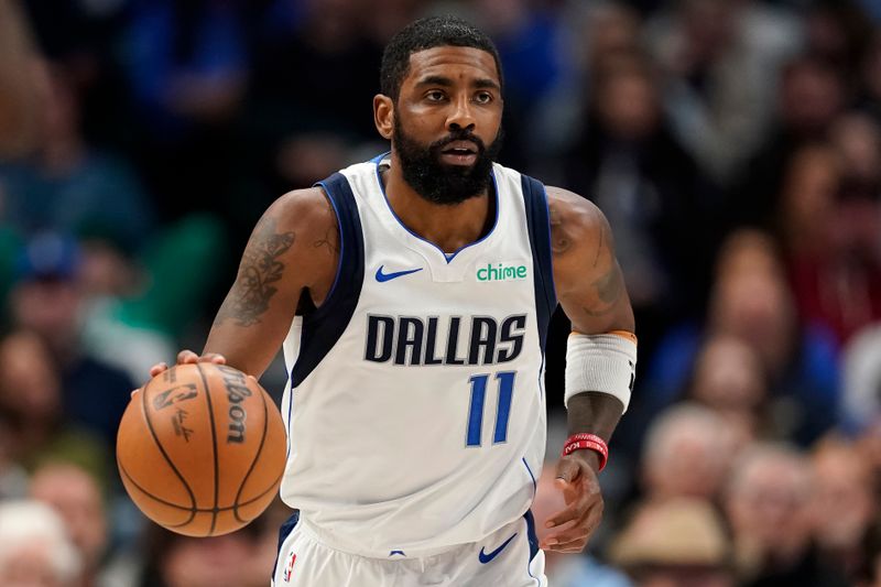 DALLAS, TEXAS - JANUARY 09: Kyrie Irving #11 of the Dallas Mavericks brings the ball up court during the first half against the Memphis Grizzlies at American Airlines Center on January 09, 2024 in Dallas, Texas. NOTE TO USER: User expressly acknowledges and agrees that, by downloading and or using this photograph, User is consenting to the terms and conditions of the Getty Images License Agreement. (Photo by Sam Hodde/Getty Images)