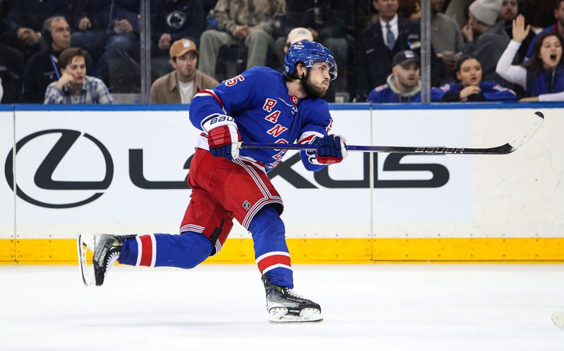 Jan 18, 2025; New York, New York, USA; New York Rangers defenseman Ryan Lindgren (55) skates a snapshot against the Columbus Blue Jackets during the third period at Madison Square Garden. Mandatory Credit: Danny Wild-Imagn Images