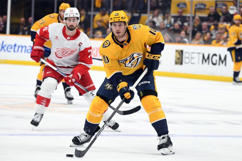 Mar 23, 2024; Nashville, Tennessee, USA; Nashville Predators center Colton Sissons (10) looks to pass the puck during the first period against the Detroit Red Wings at Bridgestone Arena. Mandatory Credit: Christopher Hanewinckel-USA TODAY Sports