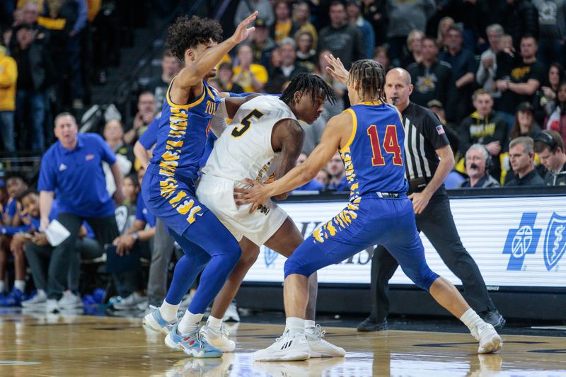 Jan 14, 2023; Wichita, Kansas, USA; Wichita State Shockers guard Jaron Pierre Jr. (5) is trapped by Tulsa Golden Hurricane guard Brian Knight (4) and Tulsa Golden Hurricane guard Anthony Pritchard (14) during the second half at Charles Koch Arena. Mandatory Credit: William Purnell-USA TODAY Sports