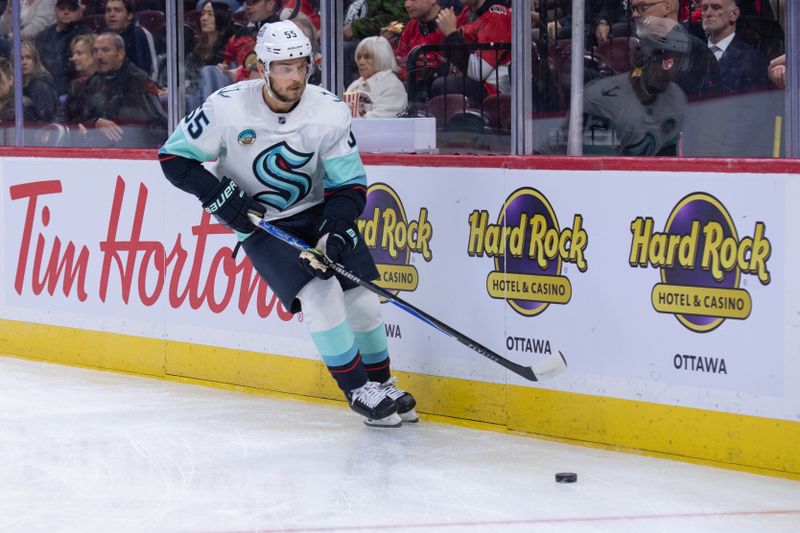 Oct 16, 2025; Ottawa, Ontario, CAN; Seattle Kraken defenseman Ryan Lindgren (55) skates with the puck in the first period against the Ottawa Senators at the Canadian Tire Centre. Mandatory Credit: Marc DesRosiers-IMAGN Images
