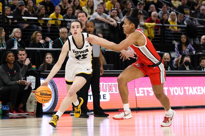 Mar 5, 2023; Minneapolis, MINN, USA; Iowa Hawkeyes guard Caitlin Clark (22) drives to the basket while Ohio State Buckeyes forward Taylor Thierry (2) defends during the first half at Target Center. Mandatory Credit: Matt Krohn-USA TODAY Sports