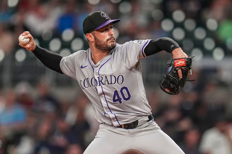 Sep 5, 2024; Cumberland, Georgia, USA; Colorado Rockies relief pitcher Tyler Kinley (40) pitches against the Atlanta Braves during the ninth inning at Truist Park. Mandatory Credit: Dale Zanine-Imagn Images