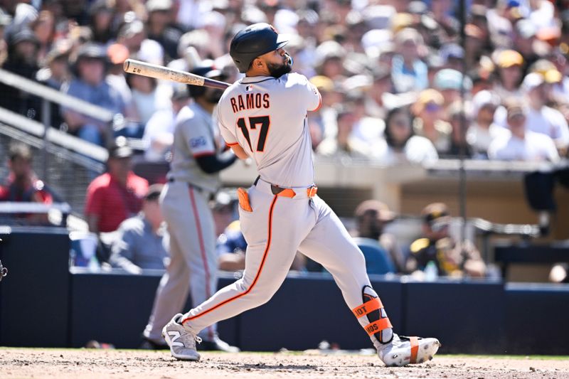 Apr 30, 2025; San Diego, California, USA; San Francisco Giants left fielder Heliot Ramos (17) hits a solo home run during the seventh inning against the San Diego Padres at Petco Park. Mandatory Credit: Denis Poroy-Imagn Images
