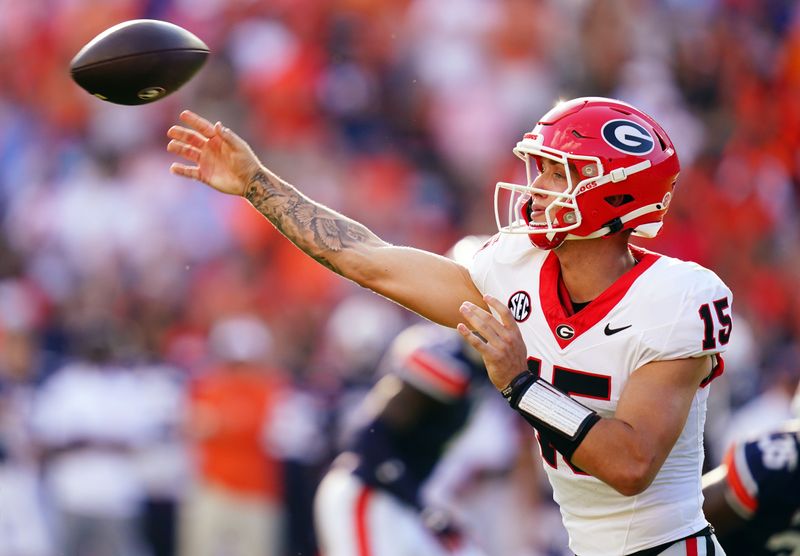 Sep 30, 2023; Auburn, Alabama, USA; Georgia Bulldogs quarterback Carson Beck (15) passing against the Auburn Tigers during the third quarter at Jordan-Hare Stadium. Mandatory Credit: John David Mercer-USA TODAY Sports