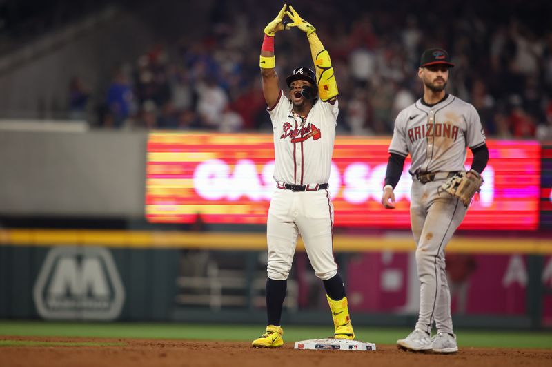 Apr 6, 2024; Atlanta, Georgia, USA; Atlanta Braves right fielder Ronald Acuna Jr. (13) celebrates after a RBI single against the Arizona Diamondbacks in the eighth inning at Truist Park. Mandatory Credit: Brett Davis-USA TODAY Sports