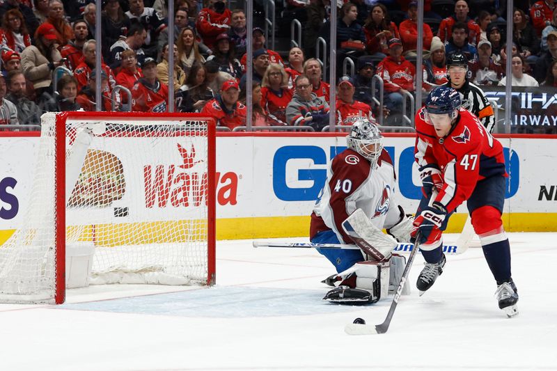 Feb 13, 2024; Washington, District of Columbia, USA; Washington Capitals left wing Beck Malenstyn (47) scores a goal on Colorado Avalanche goaltender Alexandar Georgiev (40) in the first period at Capital One Arena. Mandatory Credit: Geoff Burke-USA TODAY Sports