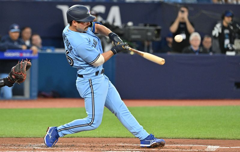 Aug 28, 2023; Toronto, Ontario, CAN;  Toronto Blue Jays third baseman Davis Schneider (36) hits an RBI single against the Washington National in the second inning at Rogers Centre. Mandatory Credit: Dan Hamilton-USA TODAY Sports