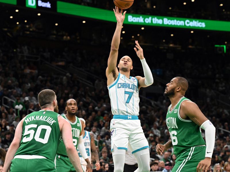 BOSTON, MASSACHUSETTS - APRIL 12: Bryce McGowens #7 of the Charlotte Hornets attempts a three-point basket against Xavier Tillman #26 of the Boston Celtics and Svi Mykhailiuk #50 during the third quarter at the TD Garden on April 12, 2024 in Boston, Massachusetts. NOTE TO USER: User expressly acknowledges and agrees that, by downloading and or using this photograph, User is consenting to the terms and conditions of the Getty Images License Agreement. (Photo by Brian Fluharty/Getty Images)