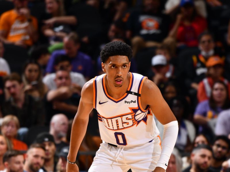 PHOENIX, AZ - OCTOBER 11: Ryan Dunn #0 of the Phoenix Suns looks on during the game against the Detroit Pistons during a NBA preseason game on October 11, 2024 at Footprint Center in Phoenix, Arizona. NOTE TO USER: User expressly acknowledges and agrees that, by downloading and or using this photograph, user is consenting to the terms and conditions of the Getty Images License Agreement. Mandatory Copyright Notice: Copyright 2024 NBAE (Photo by Barry Gossage/NBAE via Getty Images)