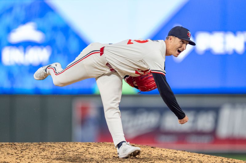 Apr 23, 2025; Minneapolis, Minnesota, USA; Minnesota Twins pitcher Griffin Jax (22) strikes out Chicago White Sox center fielder Luis Robert Jr. (88) in the seventh inning at Target Field. Mandatory Credit: Matt Blewett-Imagn Images