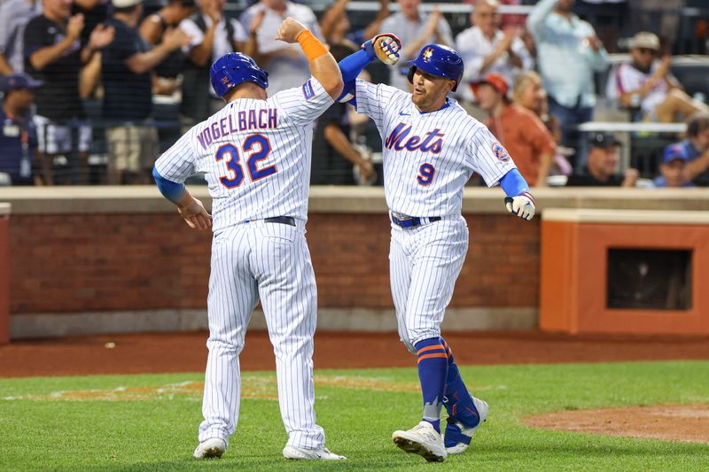 Jun 27, 2023; New York City, New York, USA; New York Mets center fielder Brandon Nimmo (9) celebrates with designated hitter Daniel Vogelbach (32) after his two run home run during the fifth inning against the Milwaukee Brewers  at Citi Field. Mandatory Credit: Vincent Carchietta-USA TODAY Sports