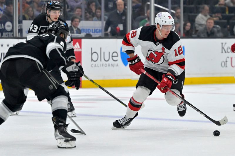 Mar 3, 2024; Los Angeles, California, USA;  New Jersey Devils left wing Ondrej Palat (18) handles the puck in the first period against the Los Angeles Kings at Crypto.com Arena. Mandatory Credit: Jayne Kamin-Oncea-USA TODAY Sports