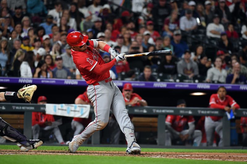 Sep 20, 2025; Denver, Colorado, USA; Los Angeles Angels designated hitter Mike Trout (27) hits his 400th career home run during the eighth inning against the Colorado Rockies at Coors Field. Mandatory Credit: Christopher Hanewinckel-Imagn Images