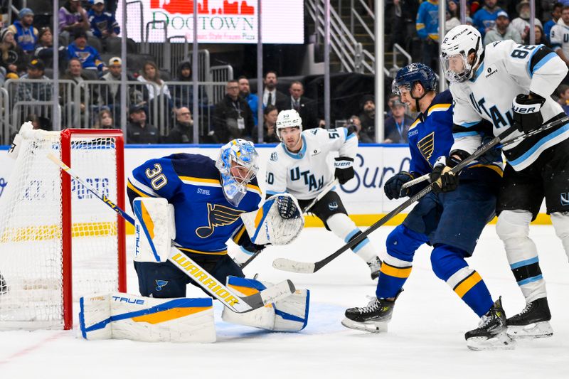 Nov 29, 2025; St. Louis, Missouri, USA; St. Louis Blues goaltender Joel Hofer (30) defends the net against the Utah Mammoth during the third period at Enterprise Center. Mandatory Credit: Jeff Curry-Imagn Images