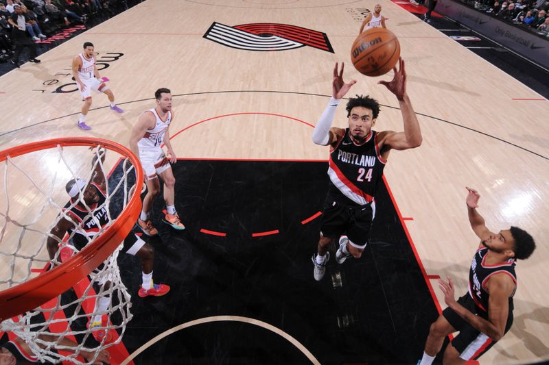 PORTLAND, OR - JANUARY 14: Justin Minaya #24 of the Portland Trail Blazers rebounds the ball during the game against the Phoenix Suns on January 14, 2024 at the Moda Center Arena in Portland, Oregon. NOTE TO USER: User expressly acknowledges and agrees that, by downloading and or using this photograph, user is consenting to the terms and conditions of the Getty Images License Agreement. Mandatory Copyright Notice: Copyright 2024 NBAE (Photo by Cameron Browne/NBAE via Getty Images)