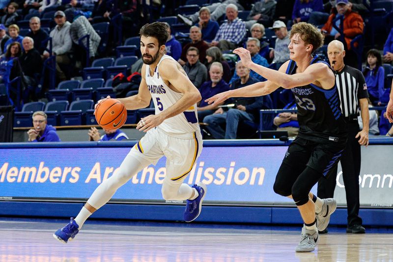 Jan 13, 2024; Colorado Springs, Colorado, USA; San Jose State Spartans forward Tibet Gorener (5) controls the ball as Air Force Falcons guard Kellan Boylan (23) guards in the first half at Clune Arena. Mandatory Credit: Isaiah J. Downing-USA TODAY Sports