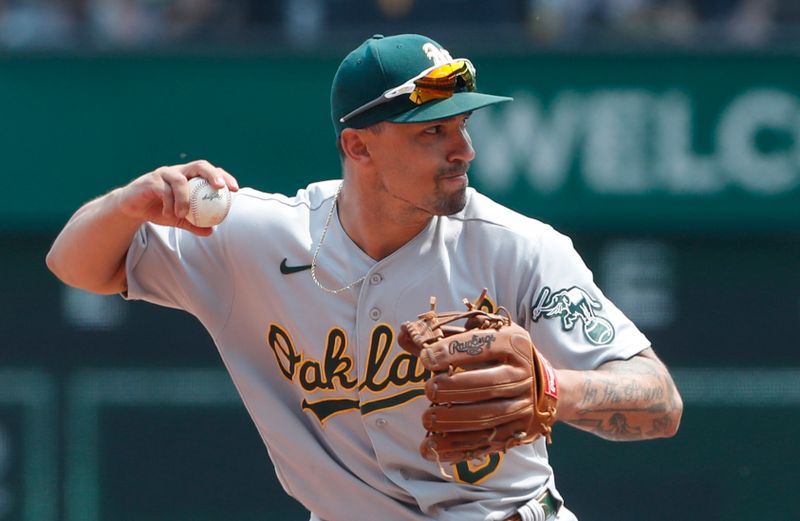 Jun 7, 2023; Pittsburgh, Pennsylvania, USA;  Oakland Athletics second baseman Jace Peterson (6) throws to first base to complete a double play against the Pittsburgh Pirates during the eighth inning at PNC Park. Oakland won 9-5. Mandatory Credit: Charles LeClaire-USA TODAY Sports