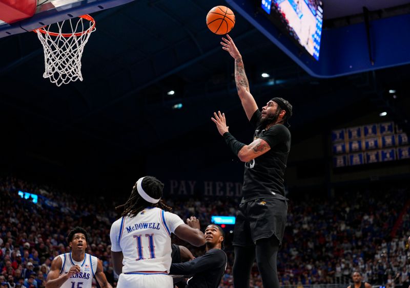 Dec 16, 2025; Lawrence, Kansas, USA; Towson Tigers forward Tyler Coleman (3) shoots during the first half against the Kansas Jayhawks at Allen Fieldhouse. Mandatory Credit: Jay Biggerstaff-Imagn Images