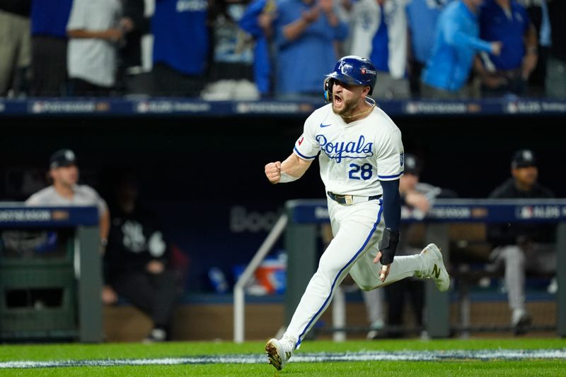 Oct 9, 2024; Kansas City, Missouri, USA; Kansas City Royals outfielder Kyle Isbel (28) scores run in the fifth inning against the New York Yankees during game three of the NLDS for the 2024 MLB Playoffs at Kauffman Stadium. Mandatory Credit: Jay Biggerstaff -Imagn Images