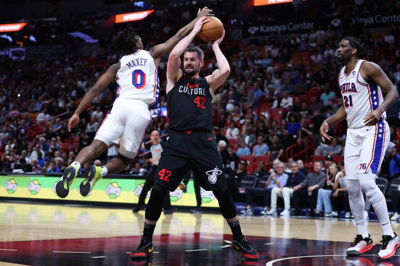 MIAMI, FLORIDA - APRIL 04: Kevin Love #42 of the Miami Heat rebounds the ball against Tyrese Maxey #0 of the Philadelphia 76ers during the second quarter of the game at Kaseya Center on April 04, 2024 in Miami, Florida. NOTE TO USER: User expressly acknowledges and agrees that, by downloading and or using this photograph, User is consenting to the terms and conditions of the Getty Images License Agreement. (Photo by Megan Briggs/Getty Images)