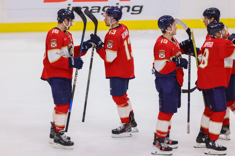 Apr 11, 2024; Sunrise, Florida, USA; Florida Panthers center Sam Reinhart (13) celebrates with teammates after the game against the Columbus Blue Jackets at Amerant Bank Arena. Mandatory Credit: Sam Navarro-USA TODAY Sports