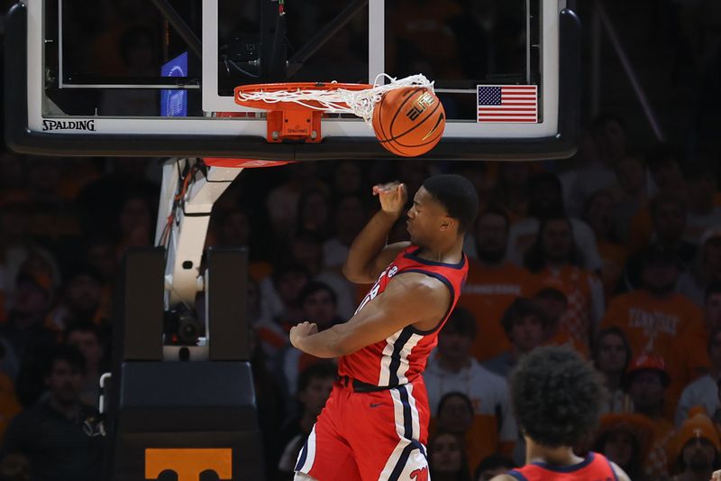 Jan 6, 2024; Knoxville, Tennessee, USA; Mississippi Rebels guard Matthew Murrell (11) dunks the ball against the Tennessee Volunteers during the first half at Thompson-Boling Arena at Food City Center. Mandatory Credit: Randy Sartin-USA TODAY Sports