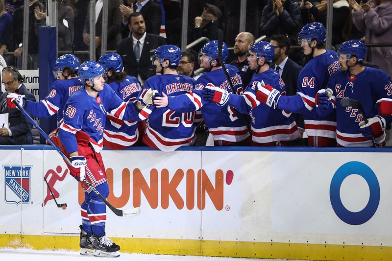 Nov 12, 2024; New York, New York, USA; New York Rangers left wing Will Cuylle (50) celebrates with his teammates after scoring a goal in the first period against the Winnipeg Jets at Madison Square Garden. Mandatory Credit: Wendell Cruz-Imagn Images